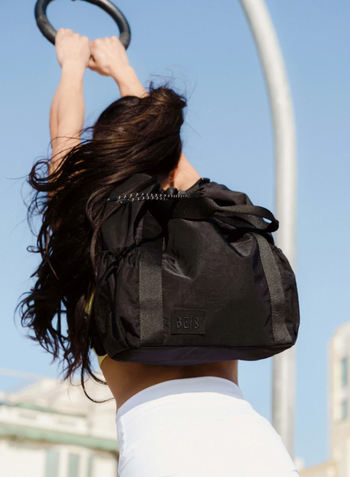 anther model wearing the backpack in black