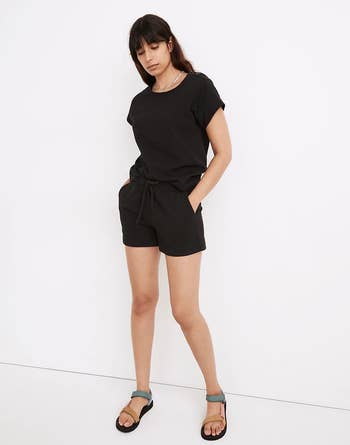 model wearing the shorts with a matching black t-shirt