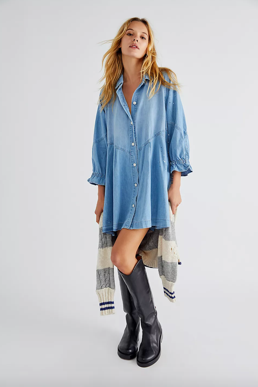 Model in button up denim midi dress with 3/4 length sleeves