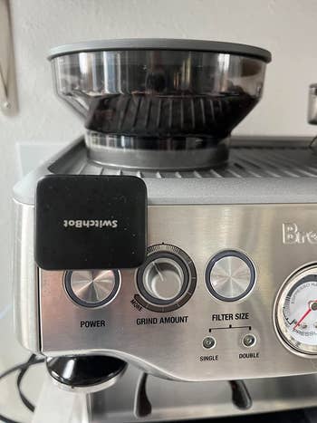 A smart button pusher on a reviewer's espresso machine