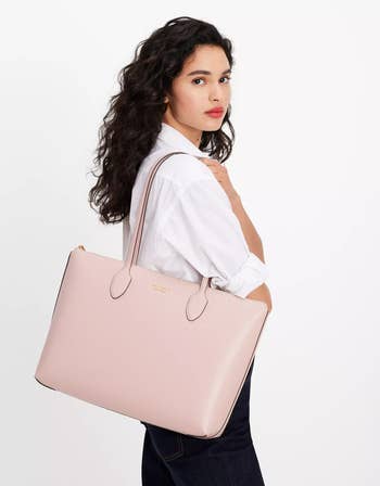 model carrying the large tote