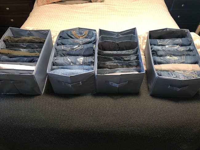 Organizers filled with folded jeans