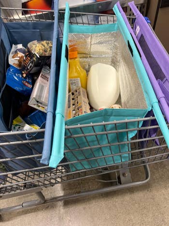 Reusable market bags successful a buying cart holding assorted items similar milk, juice, eggs, and snacks