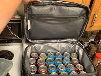 reviewer image of 24 16 ounce cans inside the cooler bag