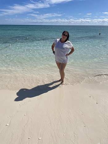 Reviewer wearing white coverup