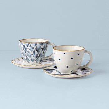two blue-patterned cups and saucers