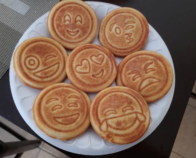 Pancakes in different emoji shapes that are happy, laughing, angry, in love, and mad 