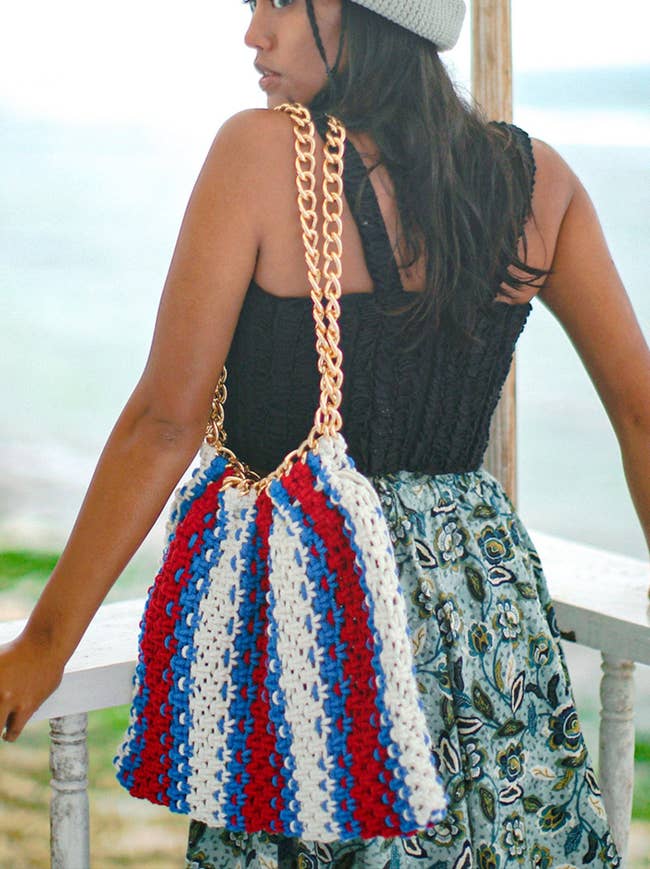 model with the red, white, and blue macrame bag