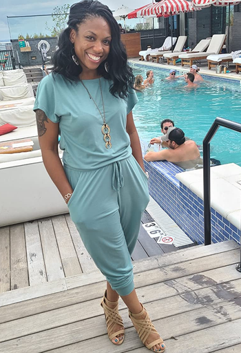 reviewer wearing the blue jumpsuit