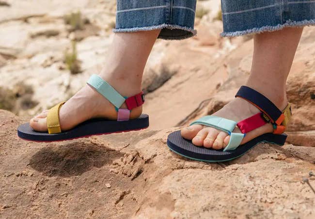 the sandals with multi-colored straps that are different on each shoe