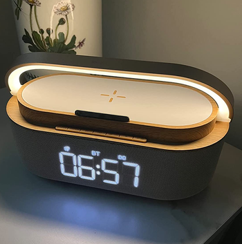 reviewer photo of the lit alarm clock at night
