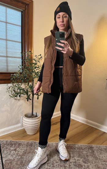 reviewer in a brown vest