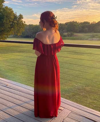 Person from behind wearing an off-shoulder red gown
