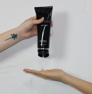 Model dispensing lubricant into hand