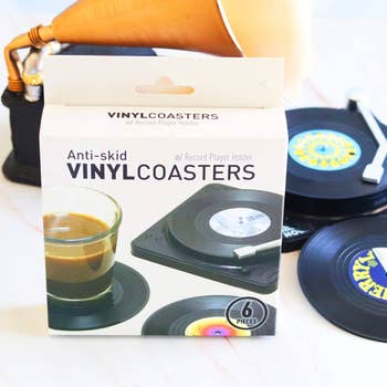 Box of anti-skid vinyl coasters with grounds   subordinate    holder, showing six pieces and a java  cupful  connected  a coaster. Vintage grounds   decor successful  background