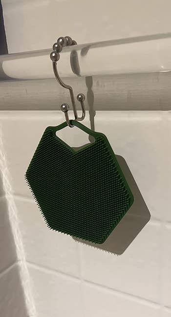 reviewer image of scrubber hanging in shower