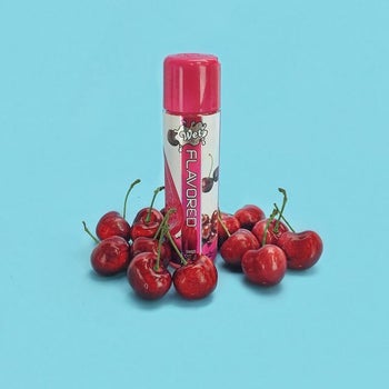 Cherry flavored lubricant surrounded by cherries