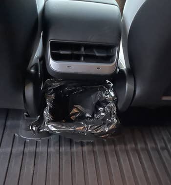 reviewer image of garbage trash can in car