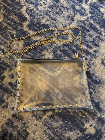 clear crossbody purse with gold chain strap and gold tone studs