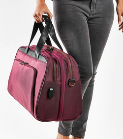 model holding the plum colored bag