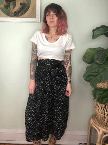 Reviewer wearing black skirt and white top