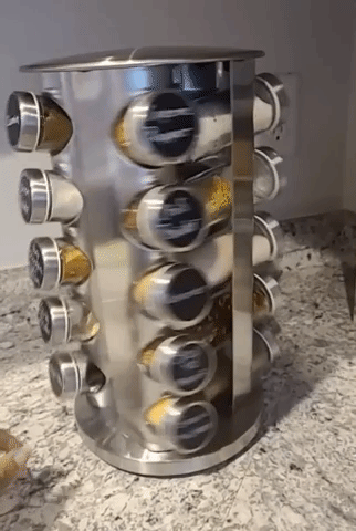 GIF of reviewer spinning the revolving spice rack