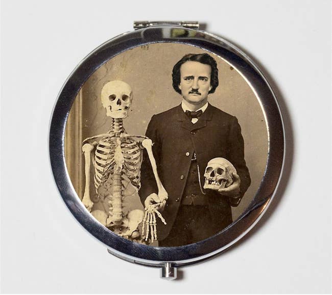 makeup mirror with a pic of Edgar Allan Poe posing with a medical skeleton