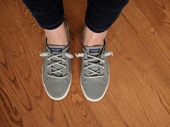 Reviewer photo of the grey Sperry sneakers