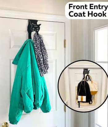 black cat coat hook on a door holding various items