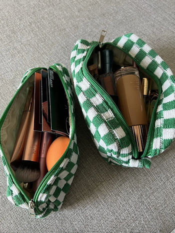 The bags open to show makeup products inside 