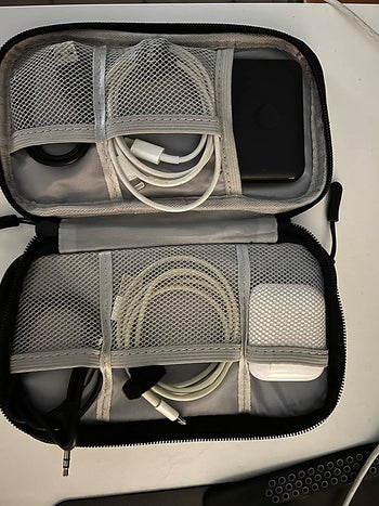 A look inside the pouch filled with chargers/cords