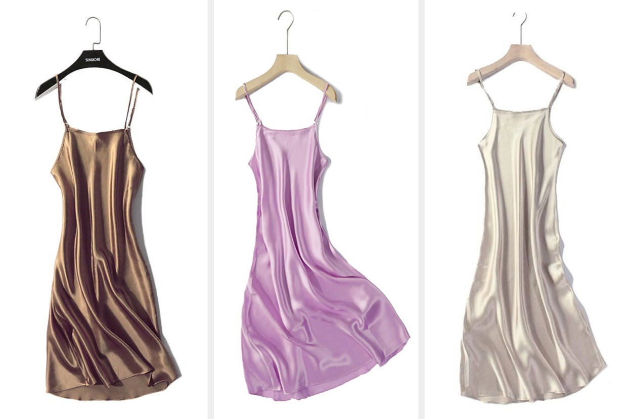Three mini spaghetti strap silk dresses in brown, purple, and cream with square neckline handing on hangers