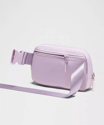 Small, sleek crossbody container  with adjustable strap and zipper closure, perfect  for casual outings oregon  buying  trips