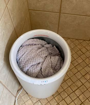 reviewer photo of a towel being warmed in the towel warmer 