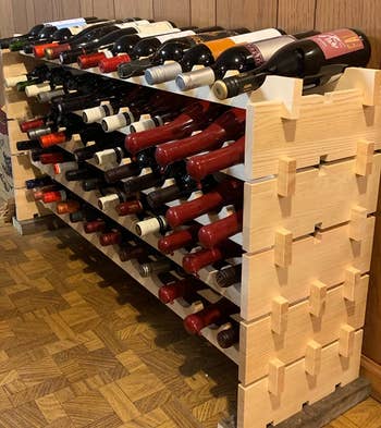 Reviewer image of the five-tier wine rack with bottles