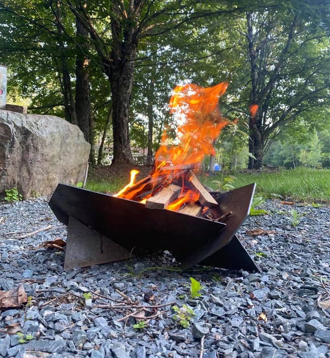 the geometric-looking firepit with a fire in it
