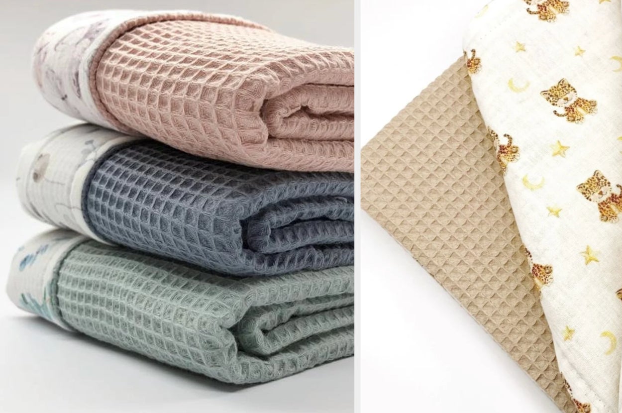 Pink, blue, and green waffle baby blankets folded and stacked on top of each other, product in beige with animals and stars on other side