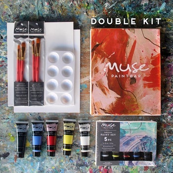 the paint kit with two brushes, a palette, and two canvases