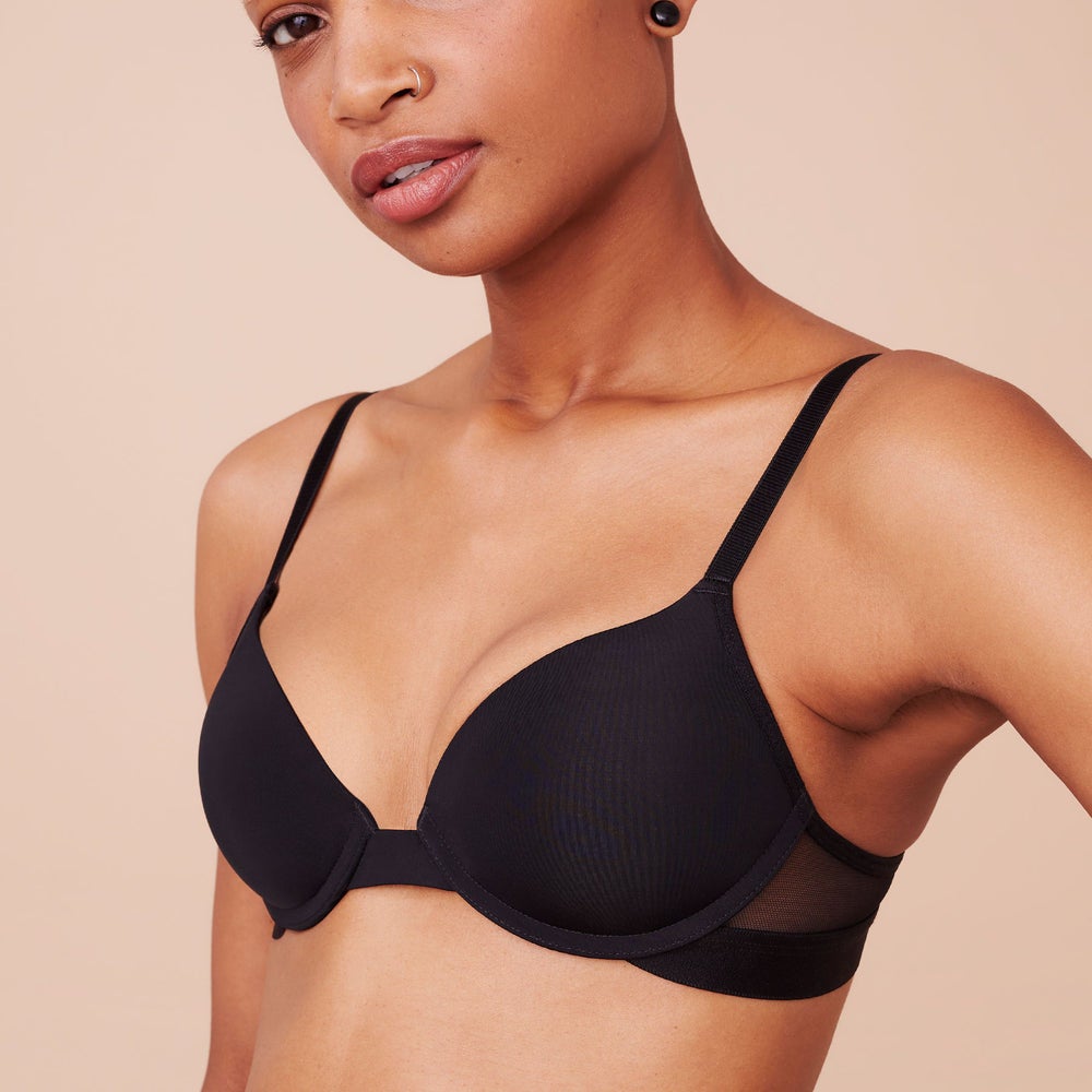 model wearing black push-up bra