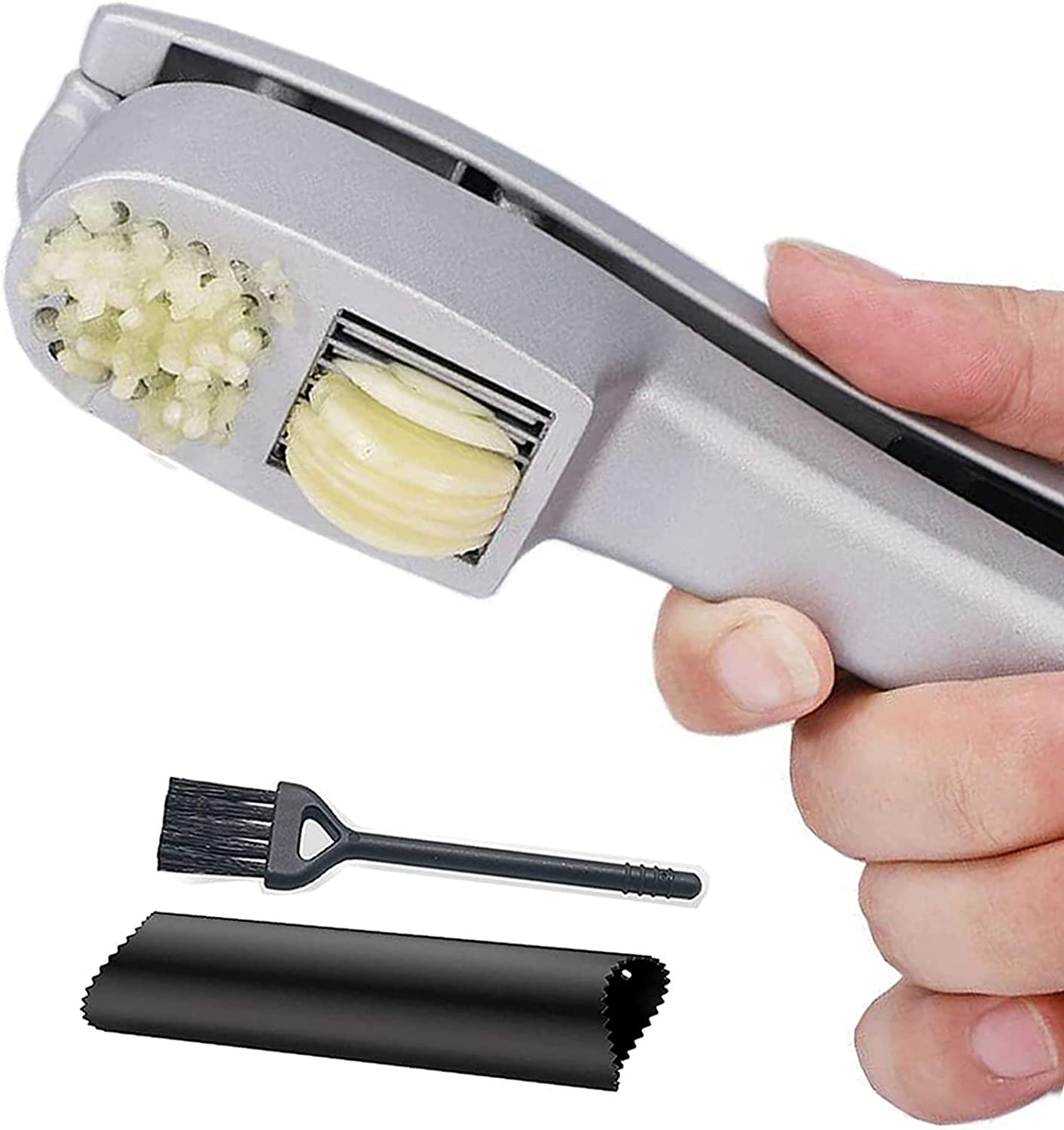 hand pressing garlic through the slicer and mincer simultaneously