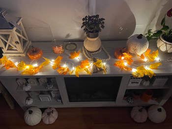 Reviewer photo of table with lighted fall garland on it