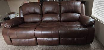 reviewer photo of brown leather three-seater sofa