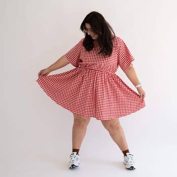 model in a red checkered dress