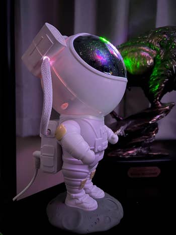 a reviwer's photo of the astronaut lamp