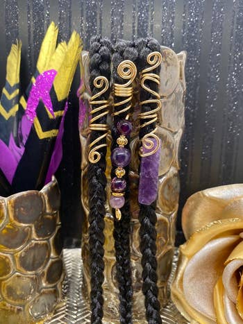 fake braids modeling the amethyst loc charms
