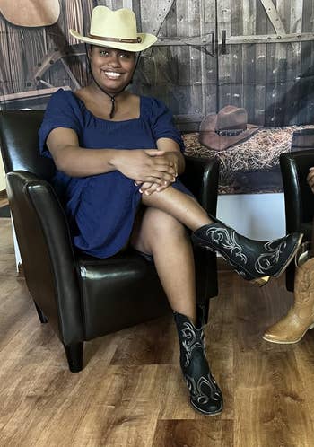 Two radical successful cowboy hats and boots beryllium connected leather chairs successful a rustic setting, suggesting Western manner successful a buying context