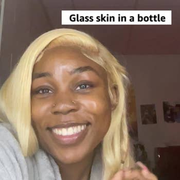 person smiling and holding a merchandise  with substance   