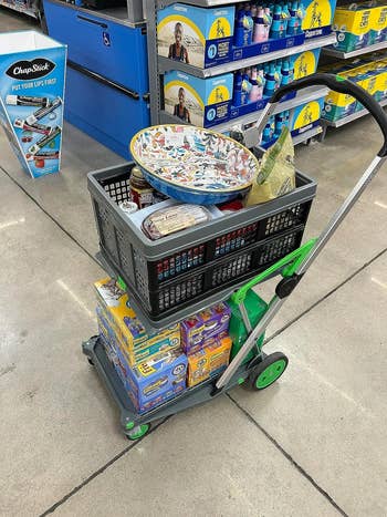 reviewer's cart at the store piled with stuff