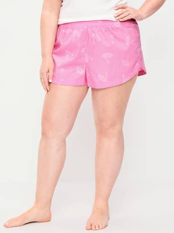 Person wearing patterned lounge shorts and a elemental  apical  poses, showcasing comfortable, casual sleepwear suitable for lounging oregon  sleep