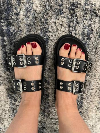 reviewer wearing the achromatic  buckle sandals